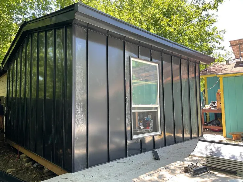 Black standing seam metal wall panels for Roof Inspection in Vernon